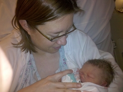 Carolyn holding Samantha, the mother-daughter bond begins